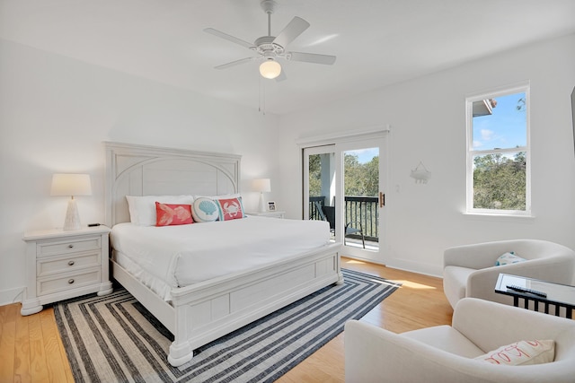 bedroom with access to exterior, light wood-style flooring, baseboards, and ceiling fan