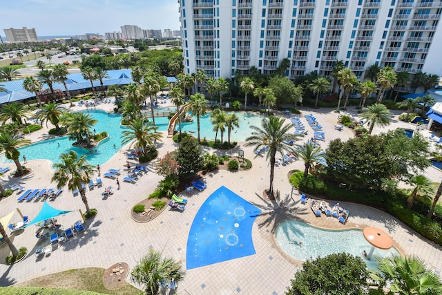 view of pool featuring a view of city