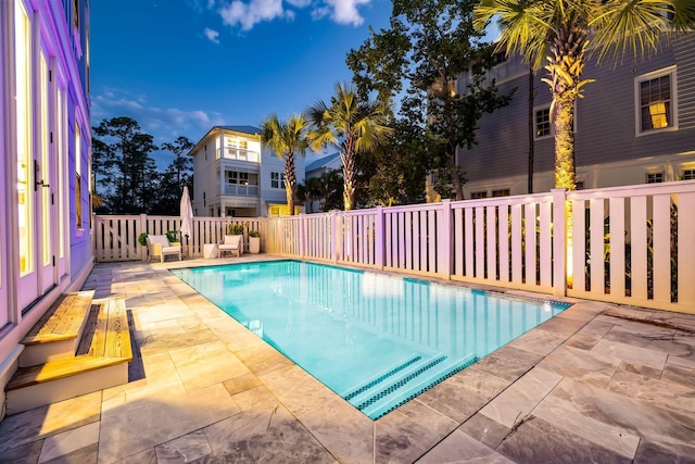 view of swimming pool featuring a fenced in pool, a patio area, and fence