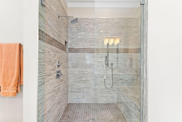 full bath featuring tiled shower