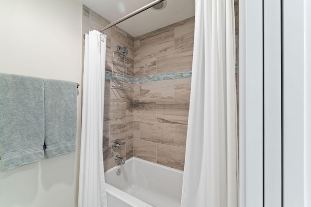 full bathroom with shower / bath combo with shower curtain