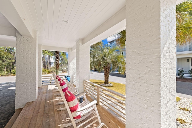 wooden terrace featuring covered porch