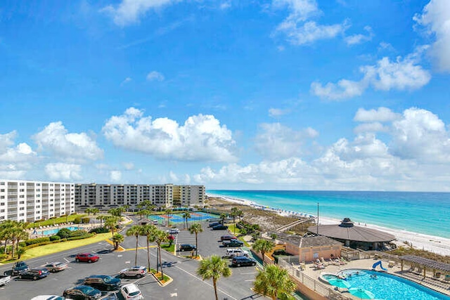 bird's eye view featuring a water view and a view of the beach