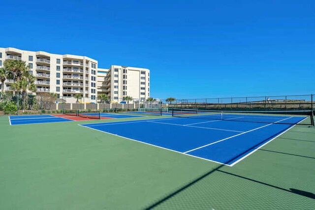 view of sport court featuring community basketball court and fence