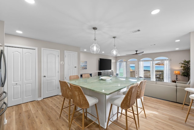 dining room featuring recessed lighting, visible vents, and light wood-style floors