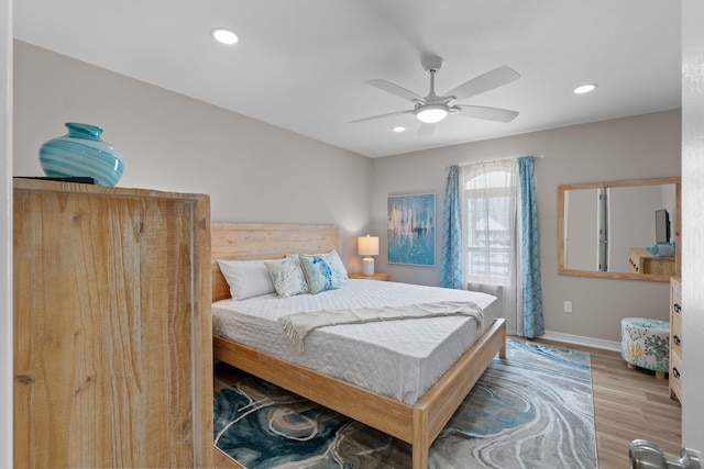 bedroom with a ceiling fan, recessed lighting, baseboards, and wood finished floors