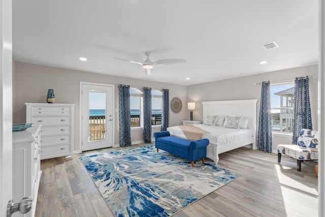 bedroom featuring recessed lighting, a ceiling fan, visible vents, light wood-style floors, and access to outside