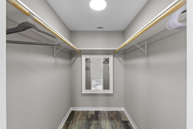 spacious closet featuring wood finished floors and visible vents