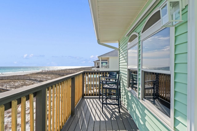 balcony with a view of the beach and a water view