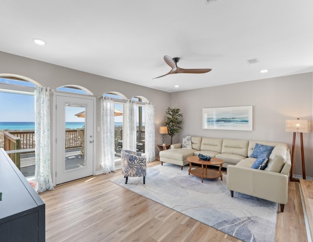 living area featuring recessed lighting, visible vents, ceiling fan, and light wood-style flooring