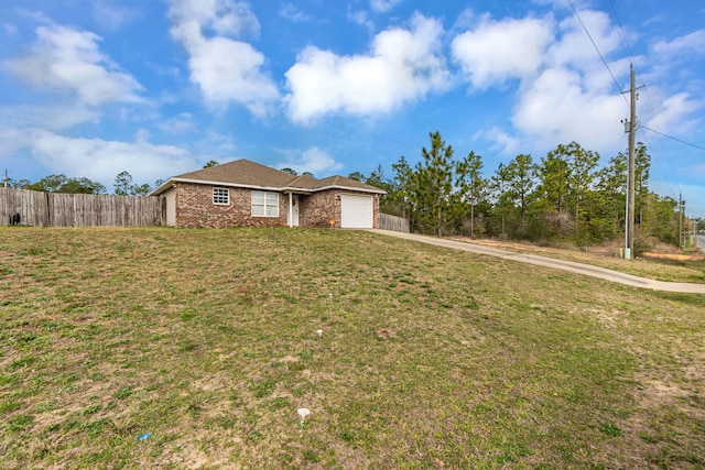 single story home featuring an attached garage, brick siding, fence, driveway, and a front yard