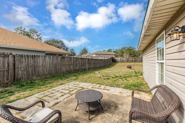 view of yard featuring a patio and a fenced backyard