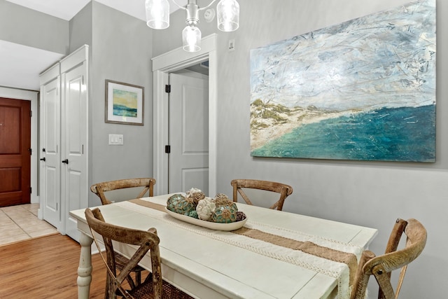 dining space with light wood finished floors