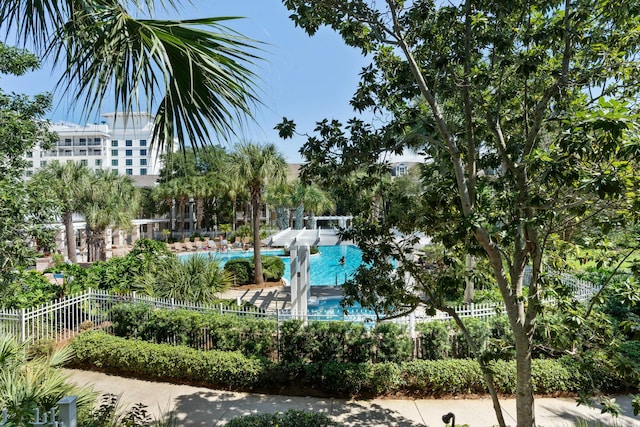 surrounding community featuring fence and a pool