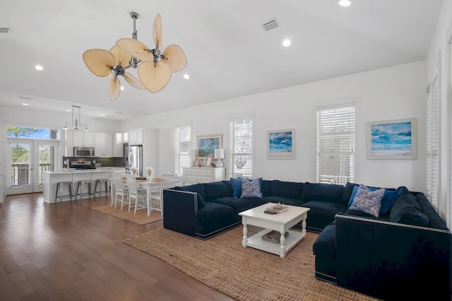 living room featuring a ceiling fan, recessed lighting, visible vents, and wood finished floors