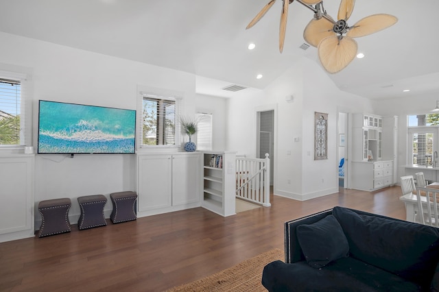 living area featuring recessed lighting, visible vents, vaulted ceiling, and wood finished floors