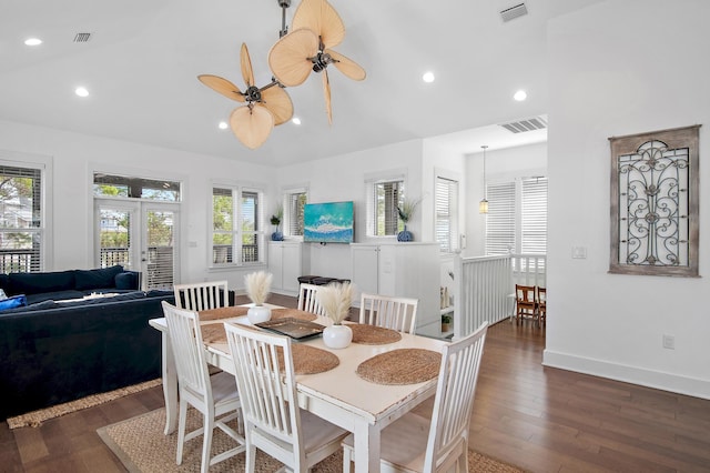 dining space with visible vents, lofted ceiling, wood finished floors, french doors, and recessed lighting