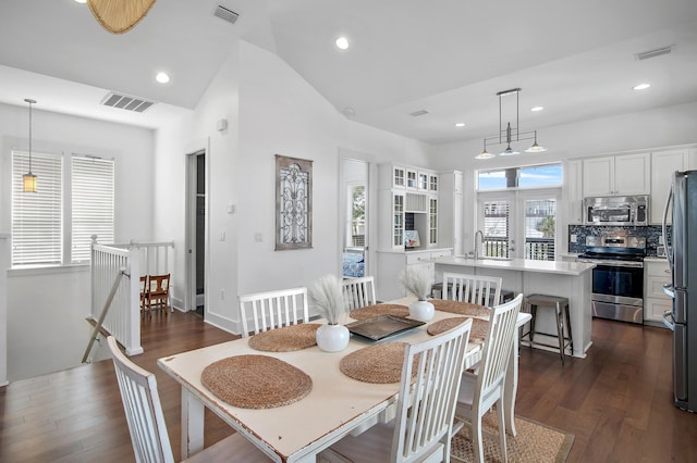 dining room with dark wood finished floors, visible vents, and recessed lighting