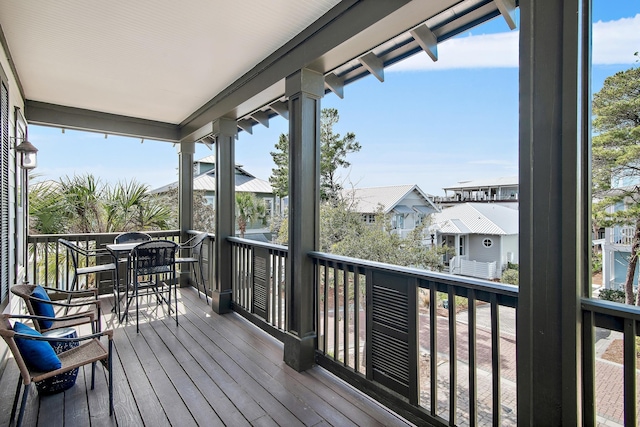 wooden terrace featuring a residential view