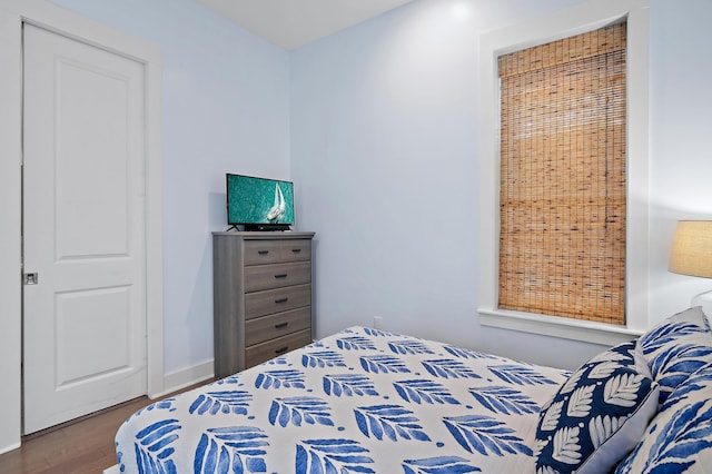 bedroom featuring wood finished floors