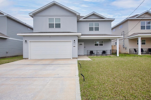 view of front of home featuring a porch, a front yard, driveway, and a garage