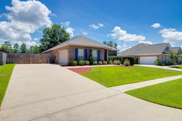 single story home with a garage, concrete driveway, brick siding, and a front lawn