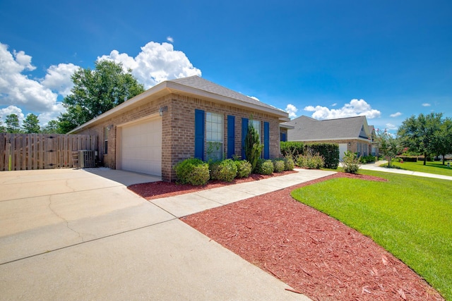 view of front of property featuring a garage, brick siding, fence, concrete driveway, and a front yard