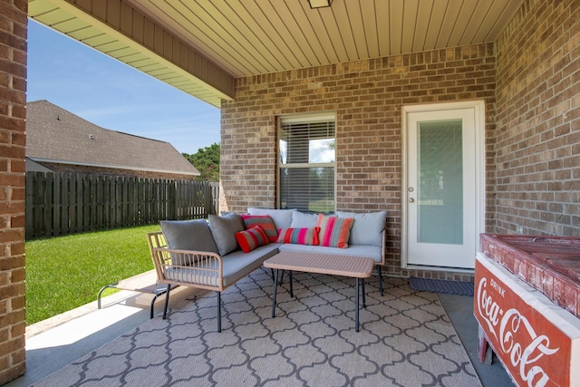 view of patio featuring fence and an outdoor living space