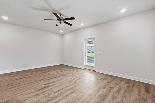 unfurnished room with light wood finished floors, baseboards, a ceiling fan, and recessed lighting