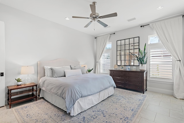 bedroom with light tile patterned floors, visible vents, baseboards, ceiling fan, and recessed lighting