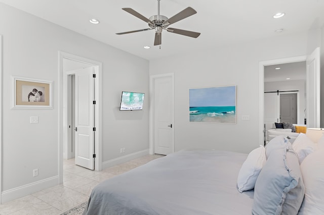 bedroom with baseboards, a barn door, a ceiling fan, and recessed lighting