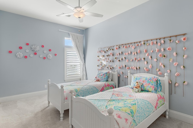 bedroom with carpet, baseboards, and a ceiling fan