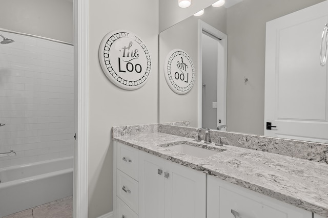 bathroom with tile patterned floors, tub / shower combination, and vanity