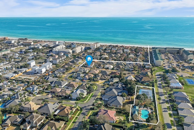 drone / aerial view featuring a water view and a residential view