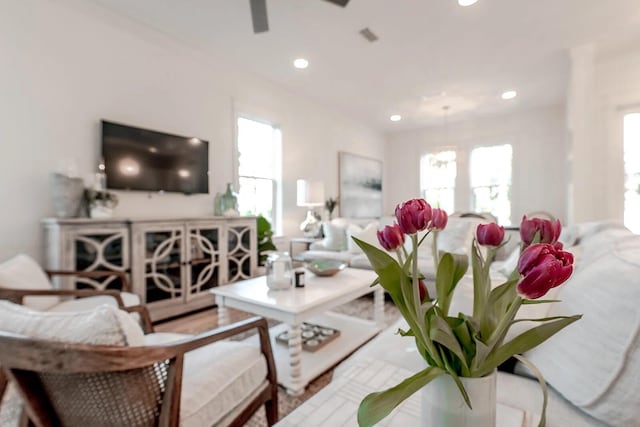 living area featuring ceiling fan, recessed lighting, and a healthy amount of sunlight