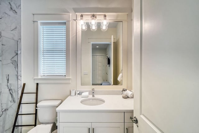 full bathroom featuring toilet, a shower, and vanity