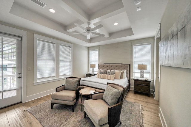 bedroom with baseboards, visible vents, coffered ceiling, and hardwood / wood-style floors