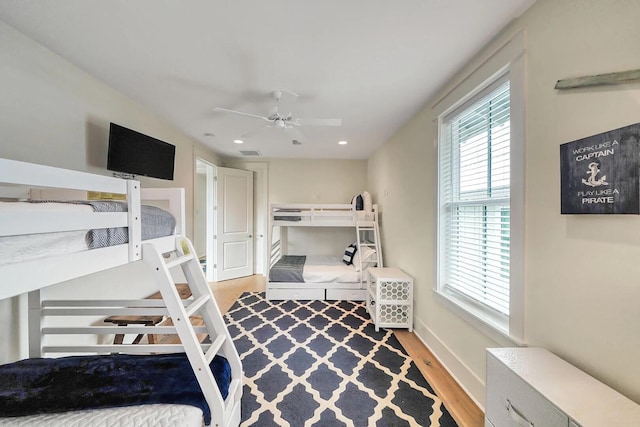 bedroom featuring recessed lighting, wood finished floors, visible vents, baseboards, and a ceiling fan