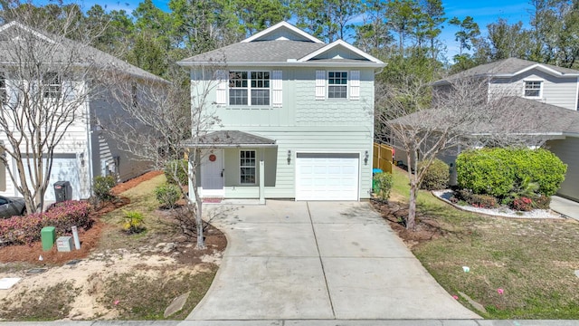 traditional-style house with a garage, a shingled roof, concrete driveway, board and batten siding, and a front yard