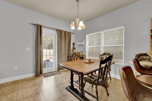 dining area with baseboards, light tile patterned floors, and a notable chandelier