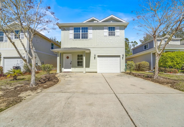 traditional home featuring concrete driveway, board and batten siding, an attached garage, and central air condition unit