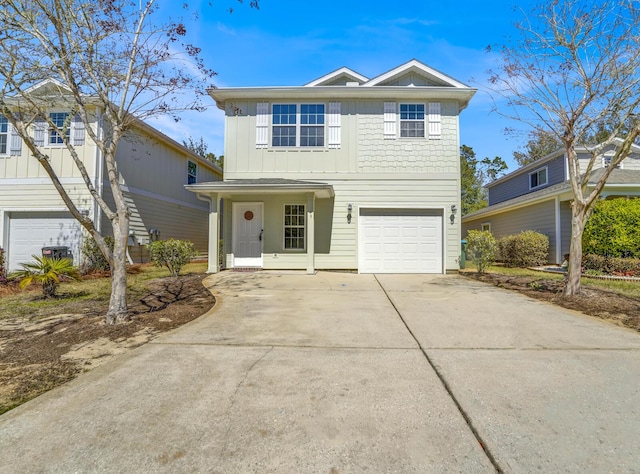 traditional-style house with driveway, board and batten siding, and an attached garage