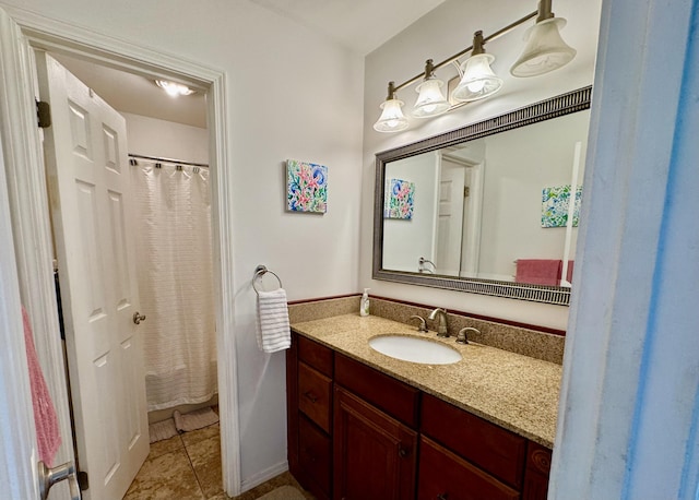 bathroom with tile patterned floors and vanity