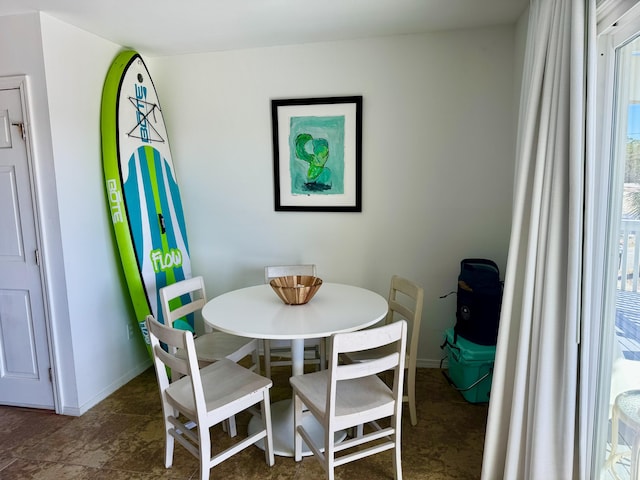 dining room featuring baseboards