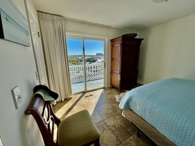 bedroom with visible vents and access to outside