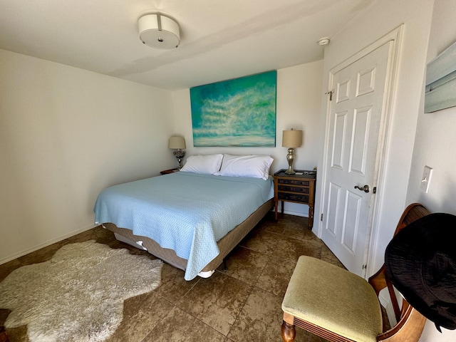 bedroom featuring baseboards