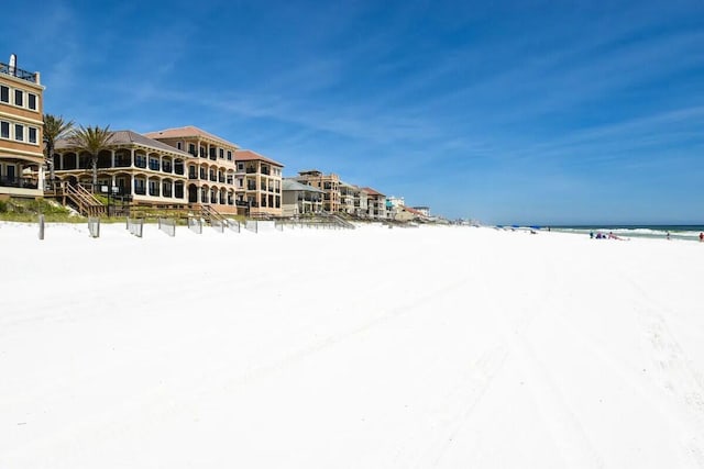 exterior space featuring a view of the beach and a water view