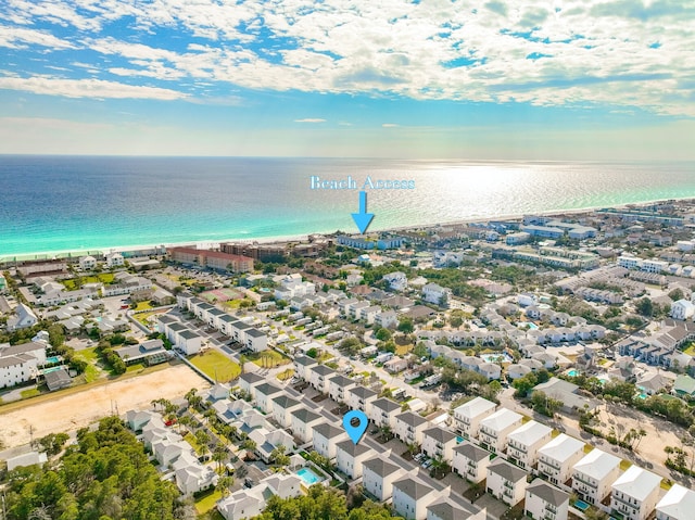 drone / aerial view with a water view and a residential view