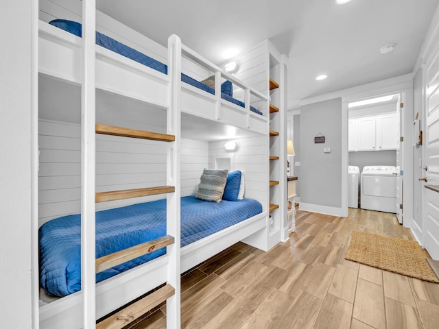 bedroom with light wood-type flooring, washer and dryer, baseboards, and recessed lighting