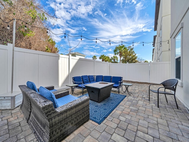 view of patio with outdoor lounge area and a fenced backyard